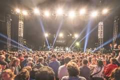 Image may contain: 1 person, crowd, night and outdoor