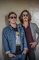 Image may contain: 2 people, people standing and sunglasses