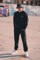 Image may contain: 1 person, standing and shoes