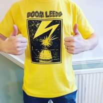 Image may contain: one or more people and people standing, text that says "BOOM BOOMLEEDS LEEDS nพmt"