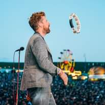 Image may contain: one or more people, people standing and outdoor