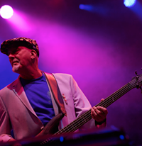 Image may contain: one or more people, people playing musical instruments, people on stage and guitar