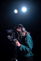 Image may contain: one or more people and camera