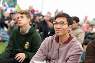 Image may contain: 2 people, glasses, phone, outdoor and close-up