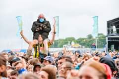 May be an image of 5 people, people standing, crowd and text that says "AWEI"