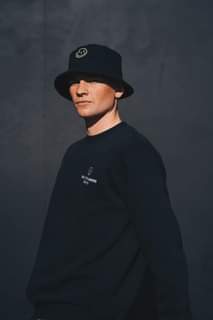 Image may contain: 1 person, hat