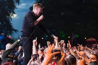 Image may contain: one or more people, people dancing, people on stage and night