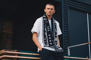 Image may contain: 1 person, standing and outdoor, text that says "SUPPO F CAL FLY"