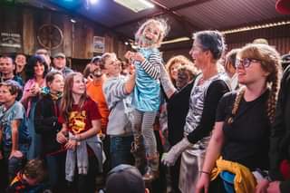 May be an image of 11 people, people standing and indoor