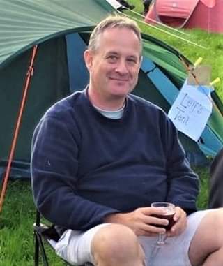 May be an image of 1 person, sitting and outdoors