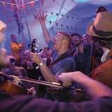 May be an image of 5 people, people playing musical instruments, people standing and indoor