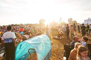 May be an image of one or more people, people standing, outdoors and crowd