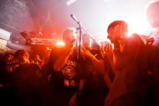 May be an image of 2 people, people standing and people playing musical instruments