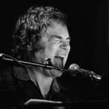 May be a black-and-white image of one or more people, people playing musical instruments and guitar