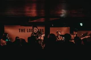 May be an image of 1 person, playing a musical instrument and standing