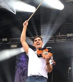 May be an image of 1 person, standing and text