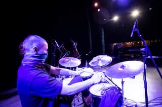 May be an image of one or more people, people playing musical instruments, cymbal and indoor