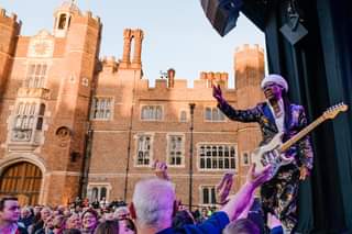 May be an image of 3 people, people playing musical instruments, people standing and outdoors