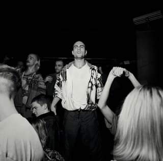 May be a black-and-white image of 5 people, people standing and indoor