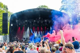 May be an image of one or more people, people playing musical instruments, people standing and outdoors