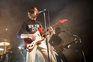 May be an image of one or more people, people playing musical instruments, people standing and guitar