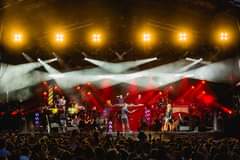 May be an image of one or more people, people playing musical instruments and people standing