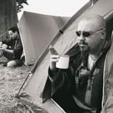 May be an image of 2 people, people camping and outdoors