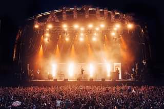May be an image of one or more people, people playing musical instruments and crowd