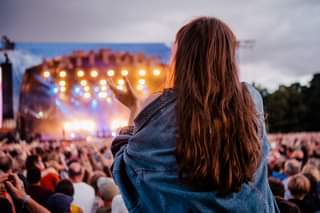 May be an image of one or more people, people standing and outdoors