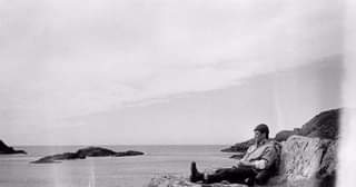 May be a black-and-white image of 1 person and body of water