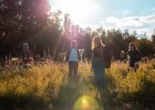May be an image of 1 person, standing, tree, grass and nature