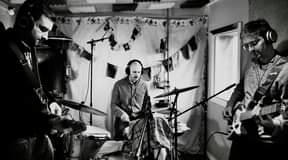 May be an image of 3 people, cymbal and indoor