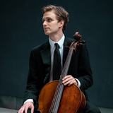 May be an image of 1 person, playing a musical instrument and indoor