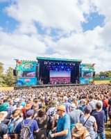 May be an image of one or more people, speaker, crowd and text