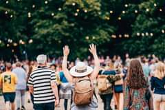 May be an image of 3 people and crowd