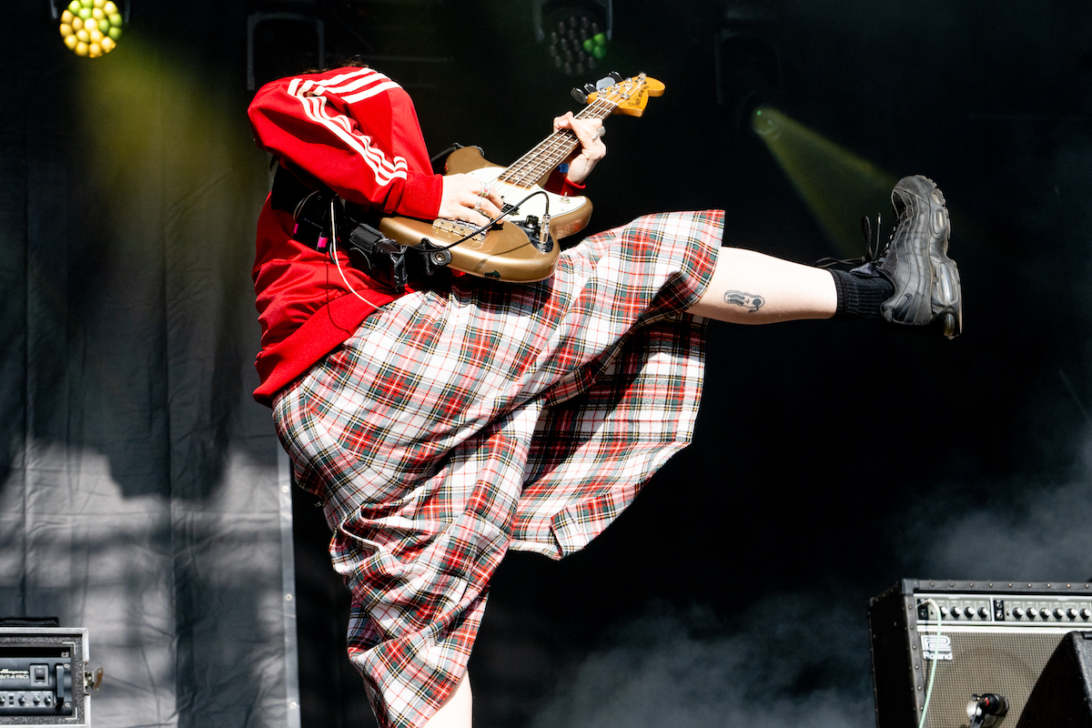 Gurriers guitarist in a kilt mid high-kick