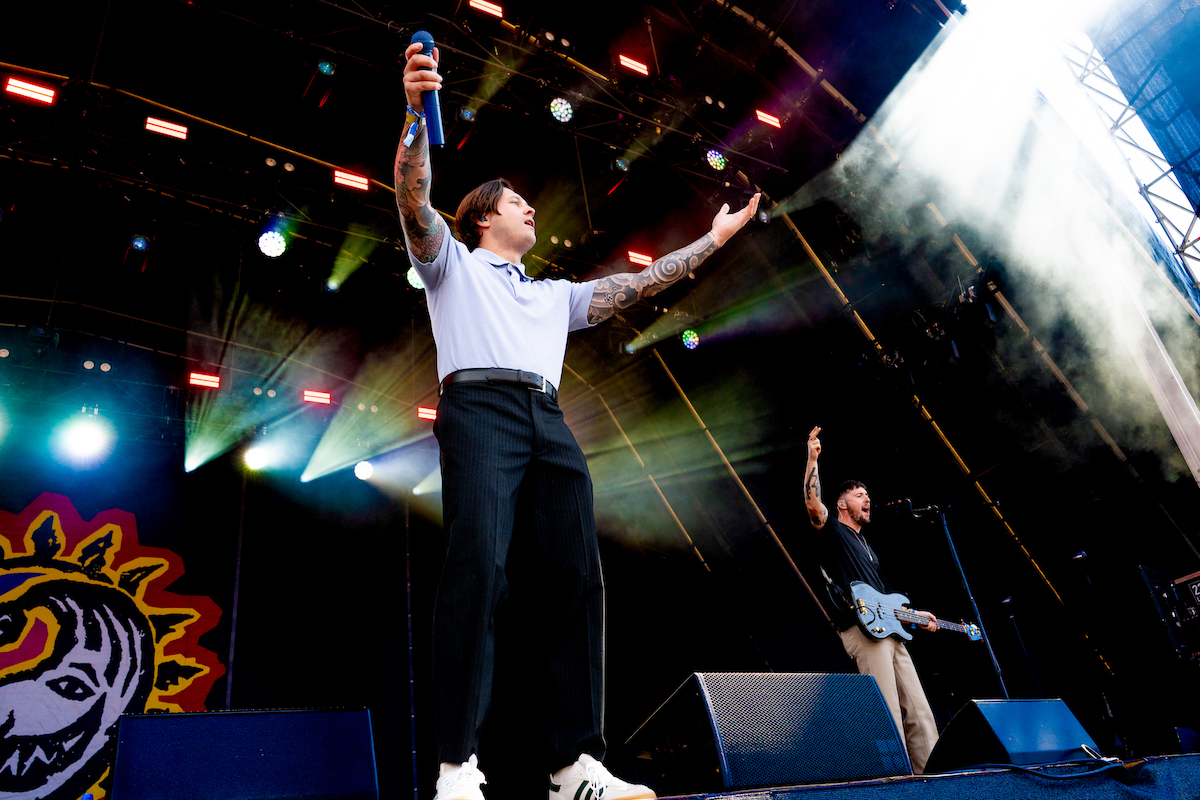 Crystal Tides' singer with arms outstretched